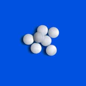 Viagra pills on blue background